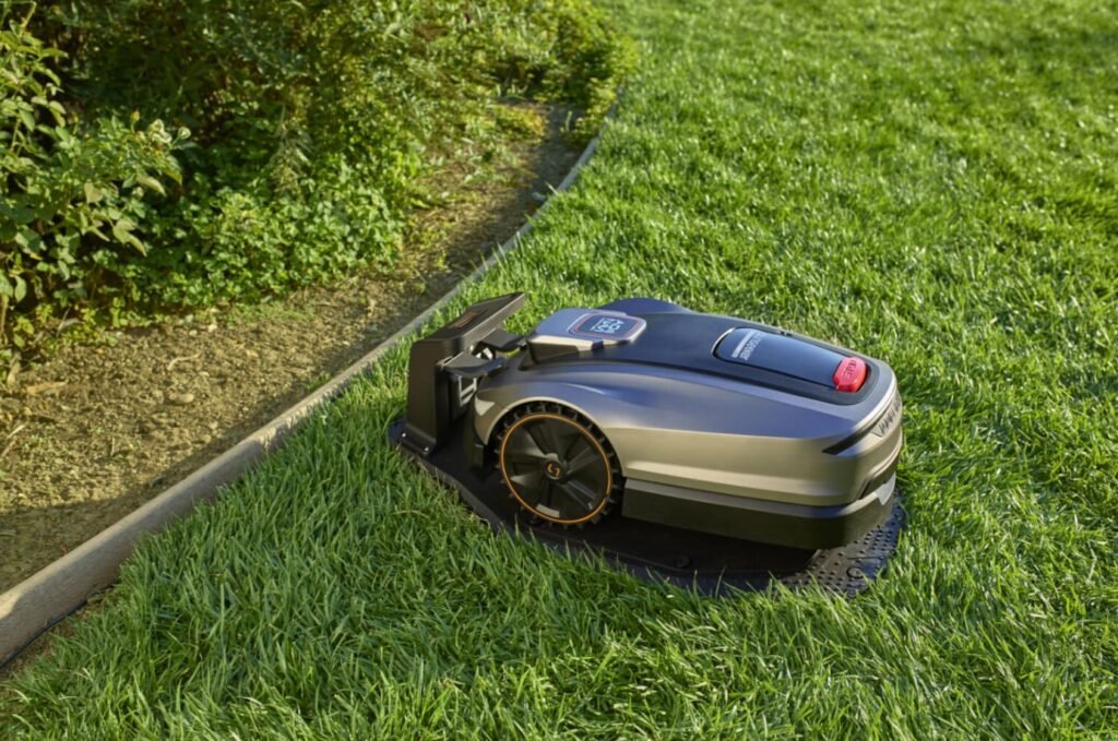 eufy S2 Max: Robot Lawn Mower That Trims the Edges eufy Robot Lawn Mower S2 Max using its extendable trimming arm along a lawn edge.