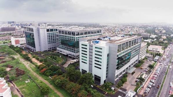 Chennai skyline and modern business buildings representing the city's technology sector.