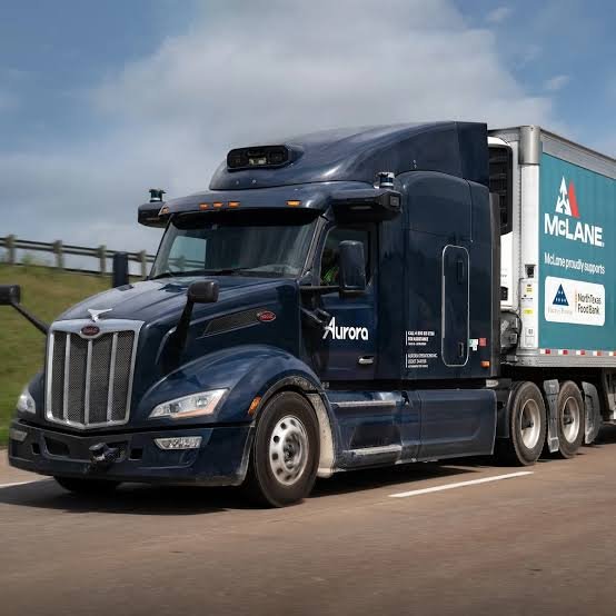 The US exemption allows qualifying Level 4 autonomous trucks to use cab-mounted warning beacons instead of traditional roadside warning devices.